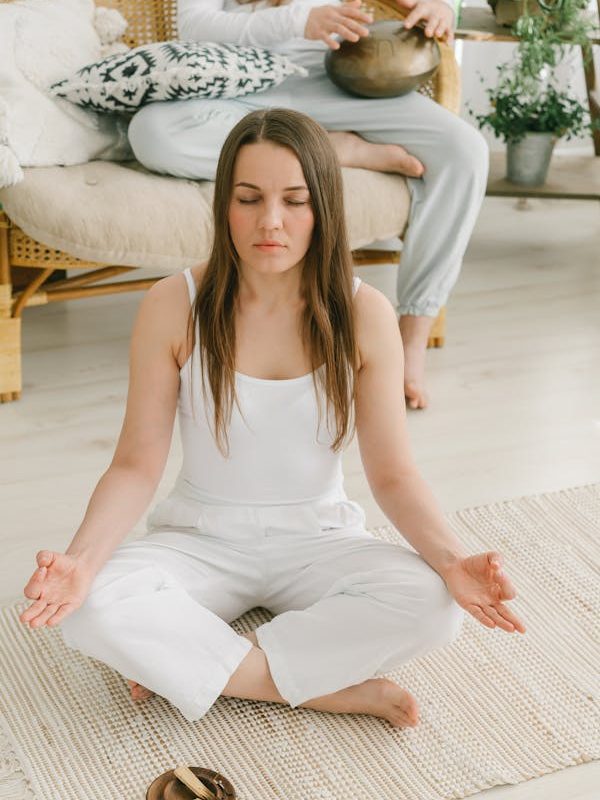 a woman meditating and sitting criss-cross. somatic therapy utah. somatic therapy in utah. therapy utah. utah therapist. Empower You Therapy. empowering you therapy